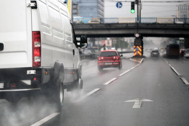 istock A vehicle moving fast on a highway in a city during heavy rain. 694244356