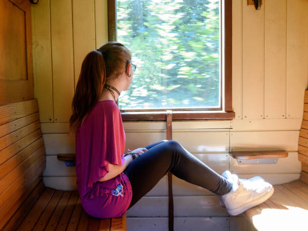 istock Lonely girl in an old train 694246992