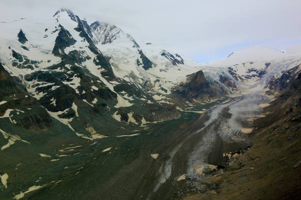 istock Glacier Pasterze and Hohe Tauern Snowcapped Austrian mountain range - Tirol Alps dramatic cloudscape Sky and landscape and Grossglockner Massif 694259278