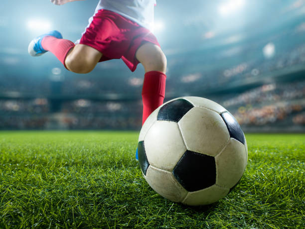 istock Close up soccer kids player with ball 694265404