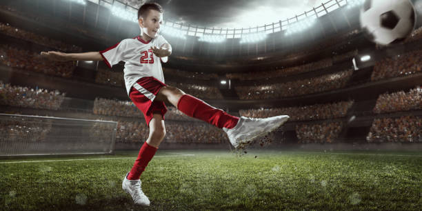 istock Soccer kids player in action in 3D dramatic stadium 694265432