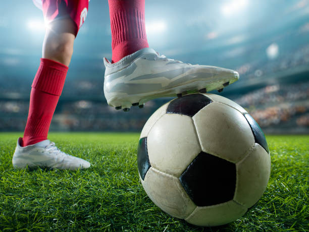 istock Close up soccer kids player with ball 694265454
