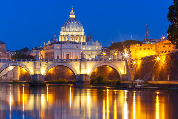 istock Saint Peter Cathedral at night in Rome, Italy 694267432