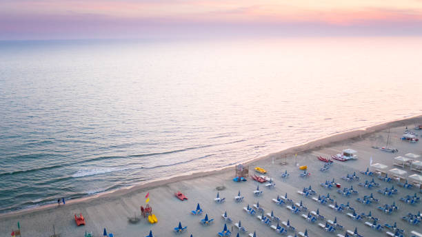 Flying over sea Aerial view taken from small airplane of the tirrenean sea at sunset rimini stock pictures, royalty-free photos & images