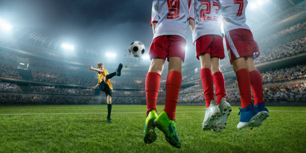 istock Soccer kids player makes a free kick 694271274
