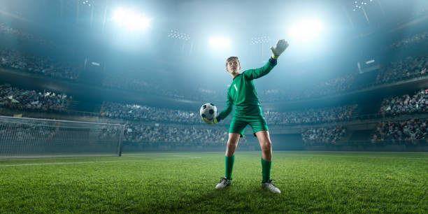 istock Soccer kids goalkeeper in action in 3D dramatic stadium 694271276