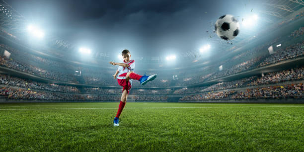 istock Soccer kids player in action in 3D dramatic stadium 694271280