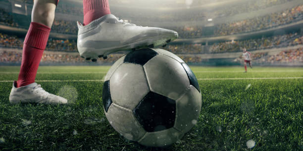 istock Close up soccer kids player with ball 694271314