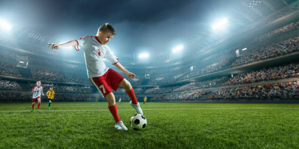 istock Soccer kids players in action in 3D dramatic stadium 694271318