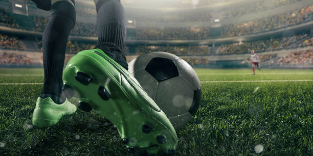 istock Close up soccer kids player with ball 694271340
