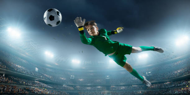 istock Soccer kids goalkeeper in action in 3D dramatic stadium 694271354