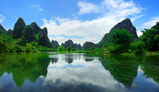 Yangzhou China jagged mountains reflecting in water