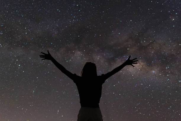 istock Milky way and woman 694283456