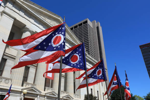 Ohio Statehouse State of Ohio flags waving in front of the Statehouse in Columbus, OG. ohio photos stock pictures, royalty-free photos & images