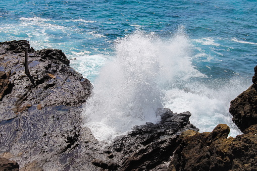 Halona Blowhole is a rock formation and a blowhole on the island of Oahu, Hawaii off of Hanauma Bay at Halona Point overlooking the Pacific Ocean.