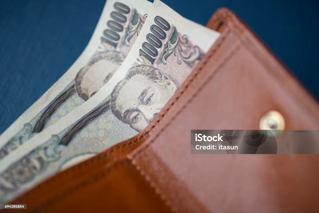 10000 Japanese Yen notes in a wallet Allowance Stock Photo