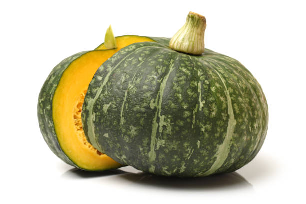 Japanese pumpkin kabocha on a white background Japanese pumpkin kabocha on a white background kabocha stock pictures, royalty-free photos & images