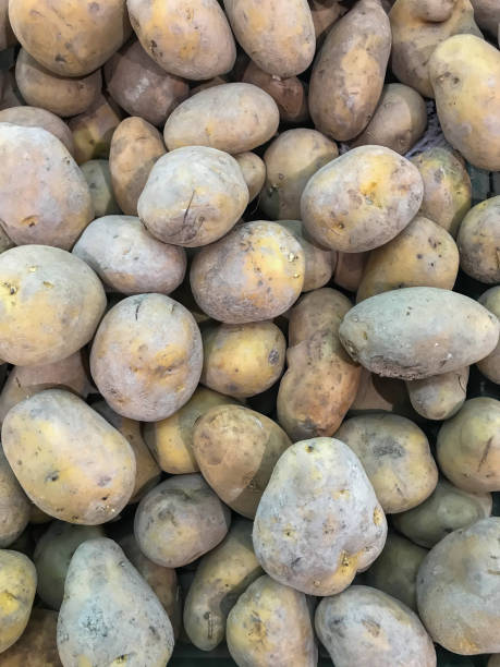 Potatoes on market. Vegetables background.