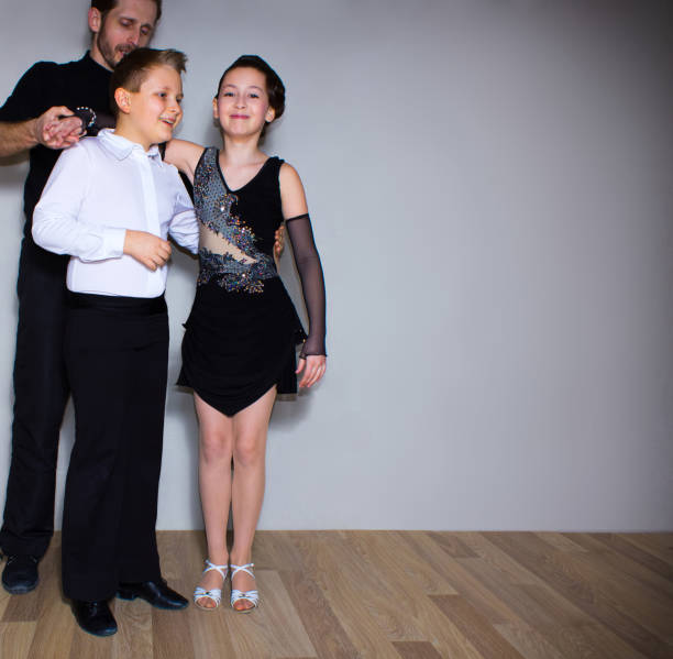 istock The young boy and girl posing at dance studio 694300224