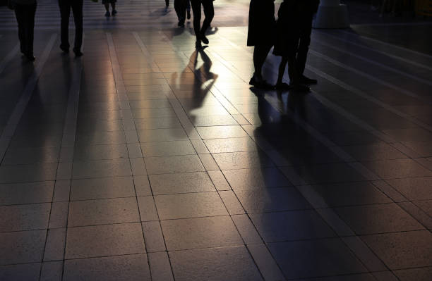 istock shadows of people walking. 694306702