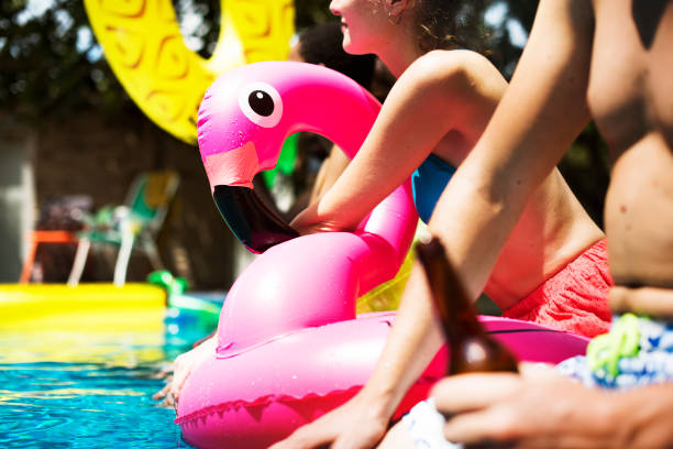 istock Diverse friends enjoying summer time by the pool 694307074