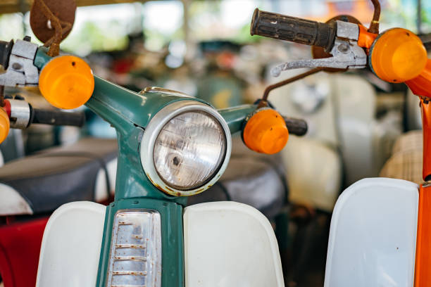 istock Headlight of green old motorcycle 694307424