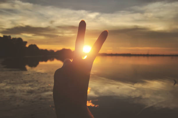 silhouette hand victory symbol stock photo