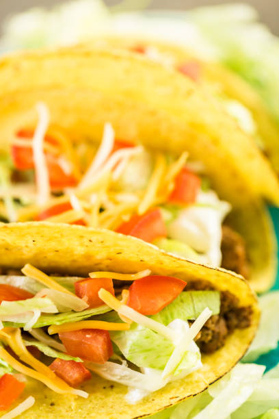 istock Fresh beef tacos in hard yellow corn taco shell 694313366