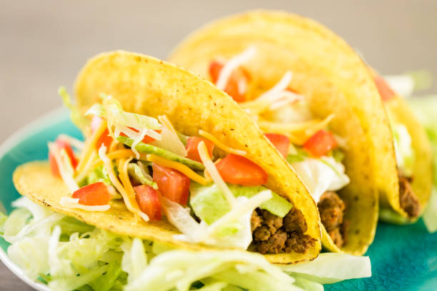 istock Fresh beef tacos in hard yellow corn taco shell 694313376