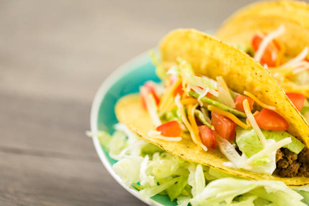 istock Fresh beef tacos in hard yellow corn taco shell 694313642