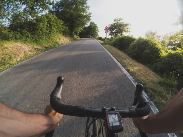 istock Cycling at sunset in Tuscany. POV 694320278