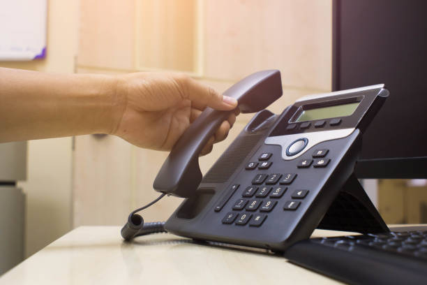 Office desk with VoIP phone connected to network port