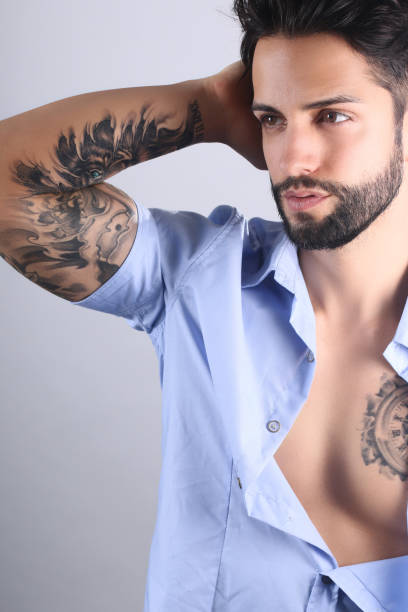 istock Sexy tattooed male posing 694322758