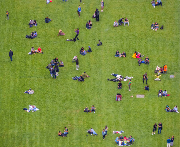 istock Aerial view crowd of people in park 694323034