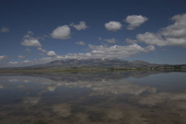 Adilcevaz village, mountain reflection of the lake Adilcevaz village, mountain reflection of the lake mimara stock pictures, royalty-free photos & images