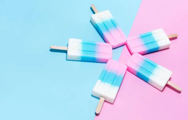 Photo of ice-cream on pink and blue background