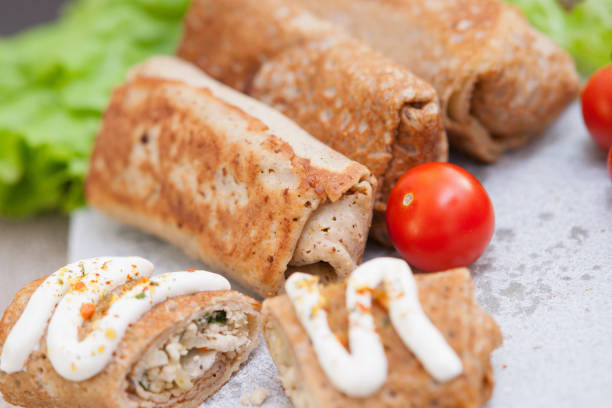 istock Pancakes with meat and vegetables 694332624