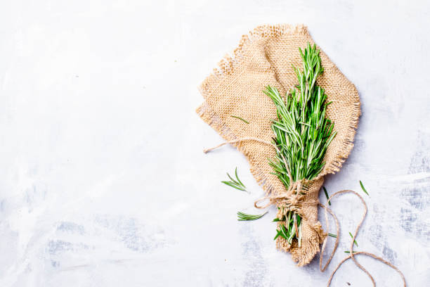 istock Fresh rosemary in a bundle on a canvas napkin 694332718
