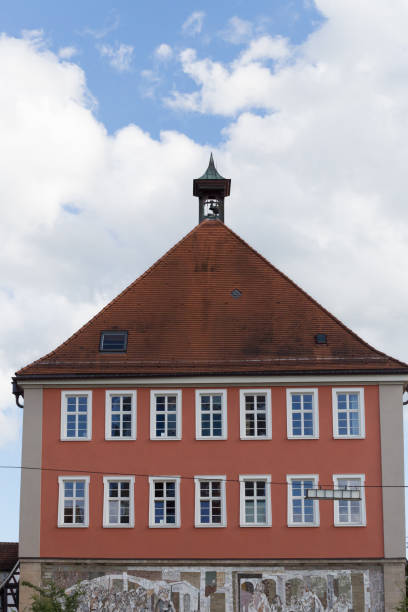 istock roofs with chimneys of historical city 694336224