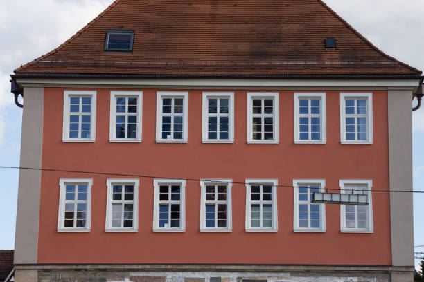istock roofs with chimneys of historical city 694336230