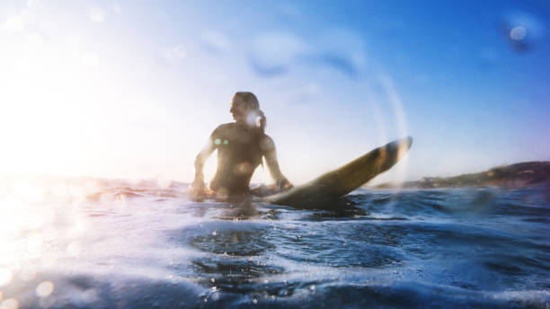 istock Summer is here: surfer girls at sea 694337778
