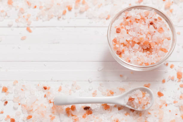 istock himalayan salt on white wooden background 694343718