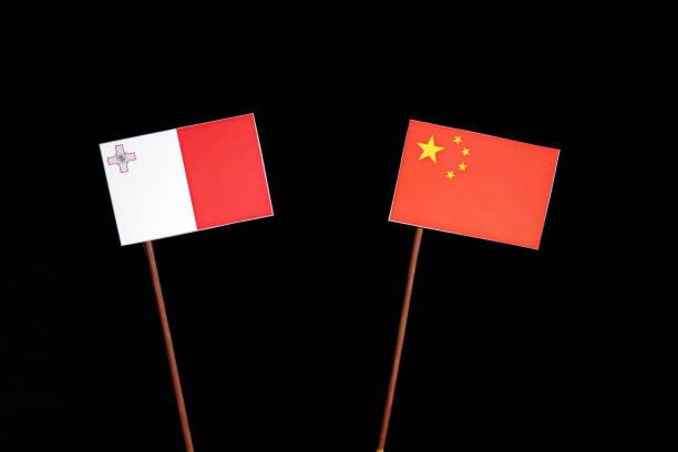istock Maltese flag with Chinese flag isolated on black background 694344178