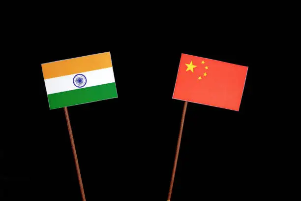 Indian flag with Chinese flag isolated on black background