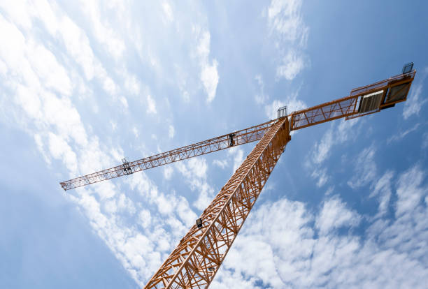 istock Big load crane at a construction site. Urban working scene 694344448