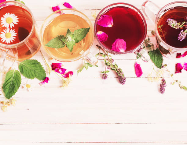 istock herbal tea on a white wooden background 694346256