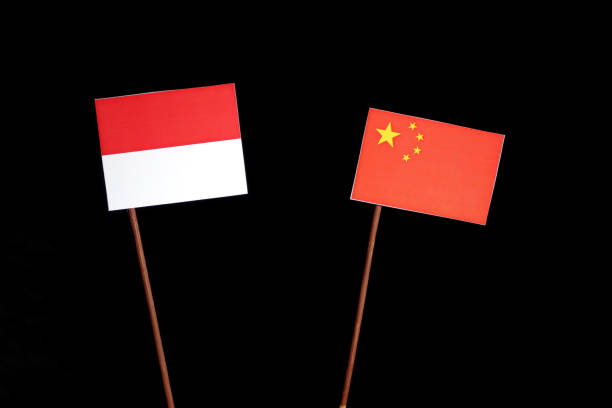 istock Monaco flag with Chinese flag isolated on black background 694350196