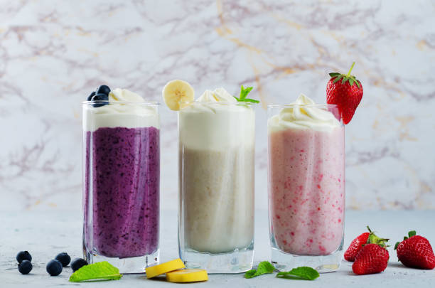 istock set of milkshakes: banana, strawberry and blueberry 694350220