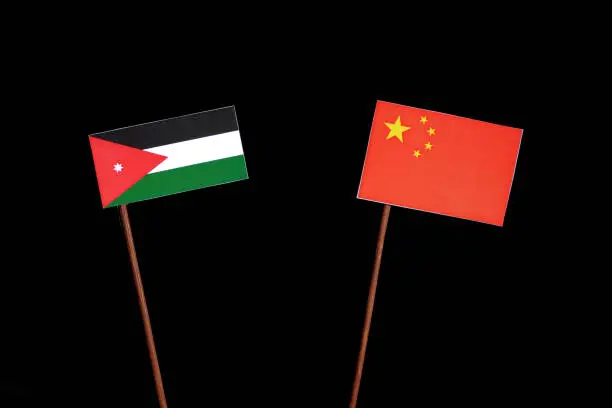 Jordanian flag with Chinese flag isolated on black background