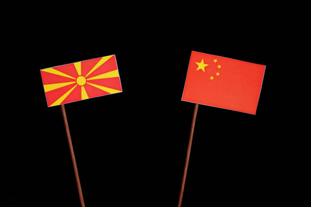 istock Macedonian flag with Chinese flag isolated on black background 694351004
